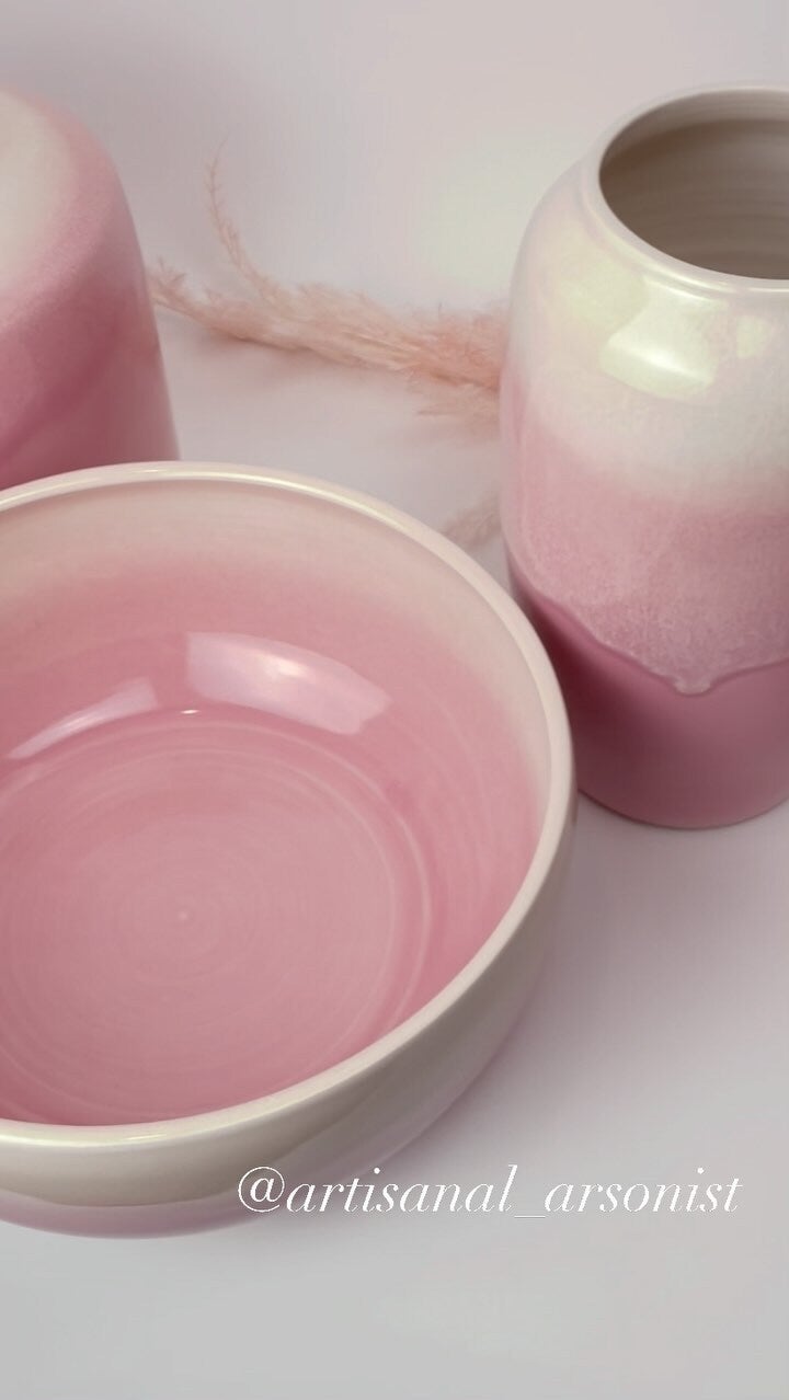 Soft pink glazed bowl and vases with a marbled finish
