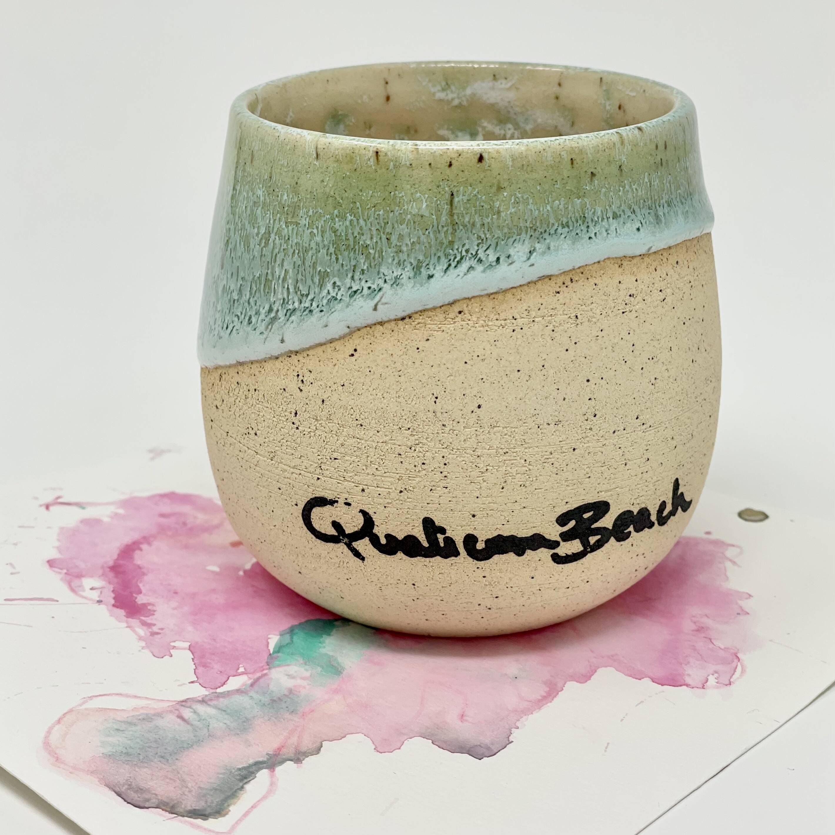 Mug glazed teal over cream, hand-lettered with 'Qualicum Beach'